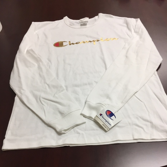 gold and white champion shirt